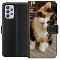 Miniatyrbilde 1 av 3: Kompatibelt Lommeboketui til Samsung Galaxy A52s 5G Trefarget kattunge med blå øyne, søtt innendørsmiljø og sjarmerende uttrykk, perfekt for alle som