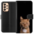 Miniatyrbilde 1 av 3: Kompatibelt Lommeboketui til Samsung Galaxy A53 5G Nærbilde av en oransje katt mot svart bakgrunn med sterk kontrast og et uttrykksfullt blikk