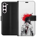 Pikkukuva 1 / 3: Yhteensopiva Lompakkokotelo Samsung Galaxy S23+ Ronaldo Red Energy -aihe, jossa Cristiano Ronaldo on tyylitellyssä puna-valkoisessa designissa ja ilm