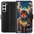 Pikkukuva 1 / 3: Yhteensopiva Lompakkokotelo Samsung Galaxy S23+ Jouluinen poro, jolla on hohtavat sarvet, punainen nenä ja neulottu vihreä pipo, seisoo reen edessä l