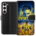 Pikkukuva 1 / 3: Yhteensopiva Lompakkokotelo Samsung Galaxy S23 Viktor Gyökeres -jalkapallojuliste keltaisensinisen värimaailman ja dramaattisen stadiontaustan kera,