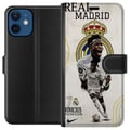 Pikkukuva 1 / 3: Yhteensopiva Lompakkokotelo Apple iPhone 12 mini Real Madrid Vinícius Júnior hyökkääjä numeron 7 paidassa seuran logo valkoinen peliasu energinen pos