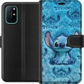 Miniatyrbilde 1 av 3: Kompatibelt Lommeboketui til OnePlus 8T Stitch sitter på et fluffy blått mønster med ansiktet og ørene sine gjentatt som tekstur, noe som skaper et s