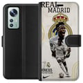 Pikkukuva 1 / 3: Yhteensopiva Lompakkokotelo Xiaomi 12 Real Madrid Vinícius Júnior hyökkääjä numeron 7 paidassa seuran logo valkoinen peliasu energinen poseeraus ja v