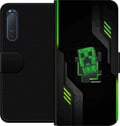 Miniatyrbild 1 av 3: Kompatibelt Plånboksfodral till Sony Xperia 5 II Grön pixelbaserad creeperliknande spelillustration i futurisk neonstil för gamingrum