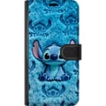 Pikkukuva 3 / 3: Yhteensopiva Lompakkokotelo Apple iPhone 12 mini Stitch istuu pörröisen sinisen kuvion päällä, jossa hänen kasvonsa ja korvansa toistuvat tekstuurina