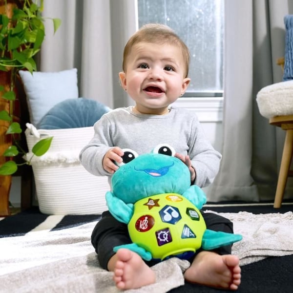 BABY EINSTEIN NEPTUN skildpadden plyslegetøj til musikalsk opvågning. Interaktiv. Flersproget. 6 instrumentlyde. Lærende farver.