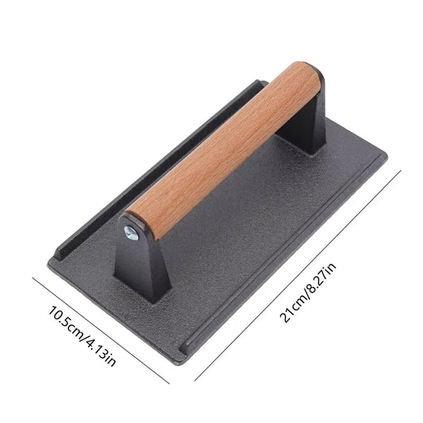 Grilliprässi ja hampurilaisprässi - Valurautainen pihvipaino - Lämpöä kestävä puukahva - Kasviöljypinnoite - Koko 21 x 10,5 cm - Paino 1 kg - Musta