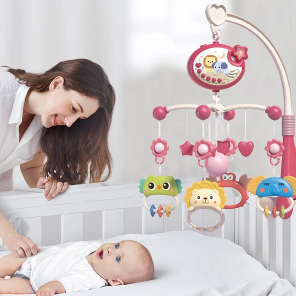 Baby uro til tremmeseng - Musikuro med projektor - Blinkende lys - Dyrefigurer - CE-certificeret - 7–12 mdr - Lyserød