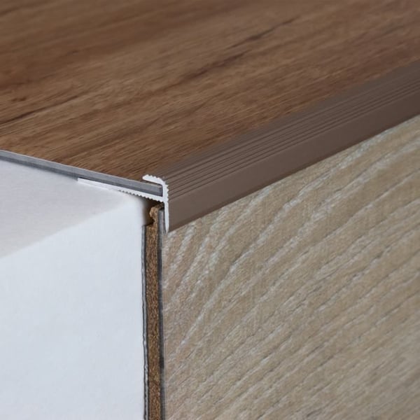 Infällningsprofil med näsa för designbeklädnader H för ram 3 mm anodiserad aluminium hålad ljusbrons-900 Infällningsprofil med näsa för designbeklädnader H för ram 3 mm anodiserad aluminium hålad ljusbrons-900