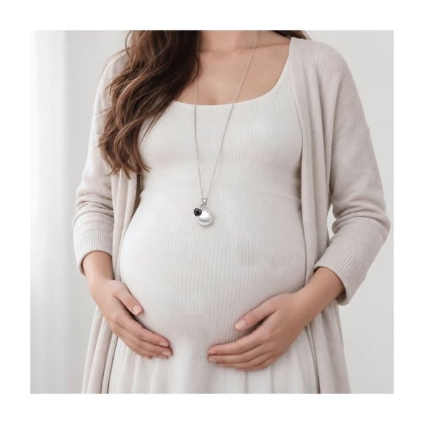 Gravid bola med dubbel silverkula och svart hjärthänge