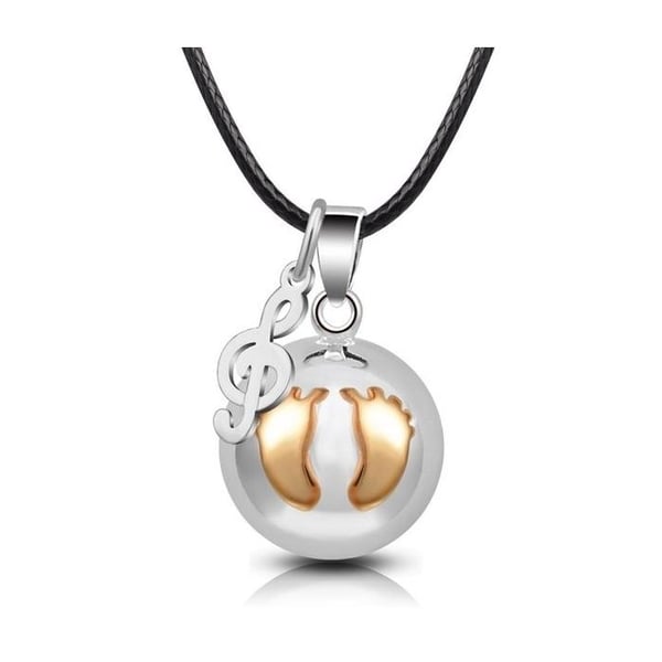 Graviditet bola boll hängen med fotspår och treble clef