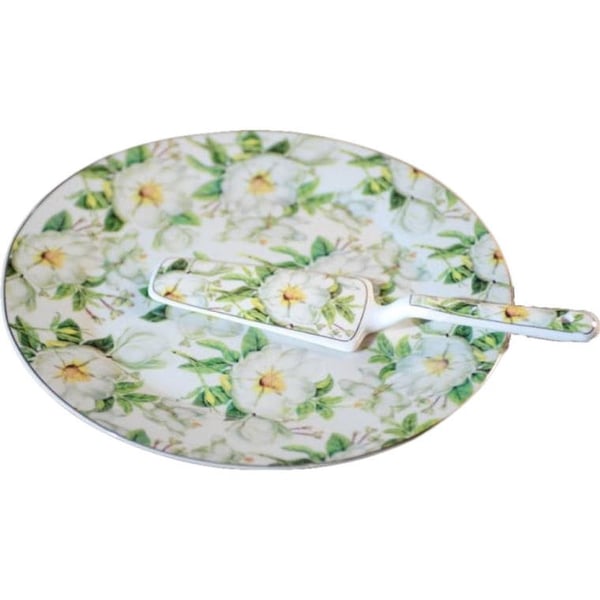 En tallerken med en kagespatula med blomster
