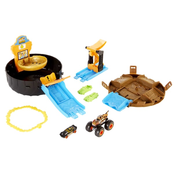 Hot Wheels Monster Trucks Stunt Tire-legesæt åbnes og bliver til en arena med en affyrer til to -biler i skala 1:64 eller en smadrende og ødelæggende Monstertruck gave til børn på 4 til 8 år