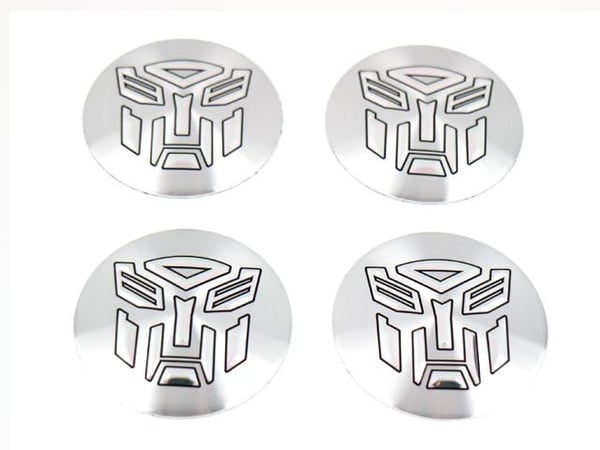 Transformers-tunnukset keskikuppeihin, pyörännapakapseleihin, vanteisiin, 4 kpl, stailaus. Transformers-tunnukset keskikuppeihin, pyörännapakapseleihin, vanteisiin, 4 kpl, stailaus.