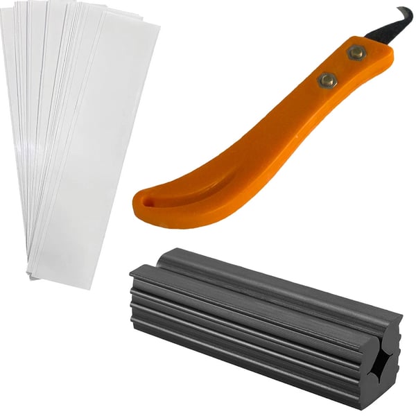 Kit med grepptejp, kniv och gummiklämma