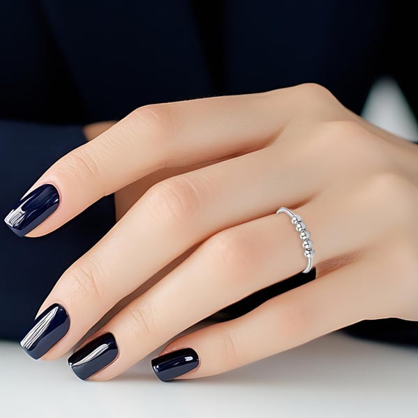 Justerbar antistressring med roterbare perler Silver