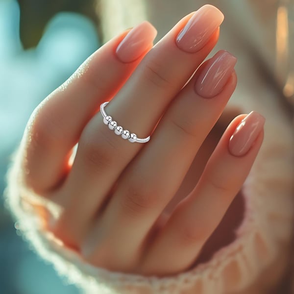 Justerbar antistressring med roterbare perler Silver