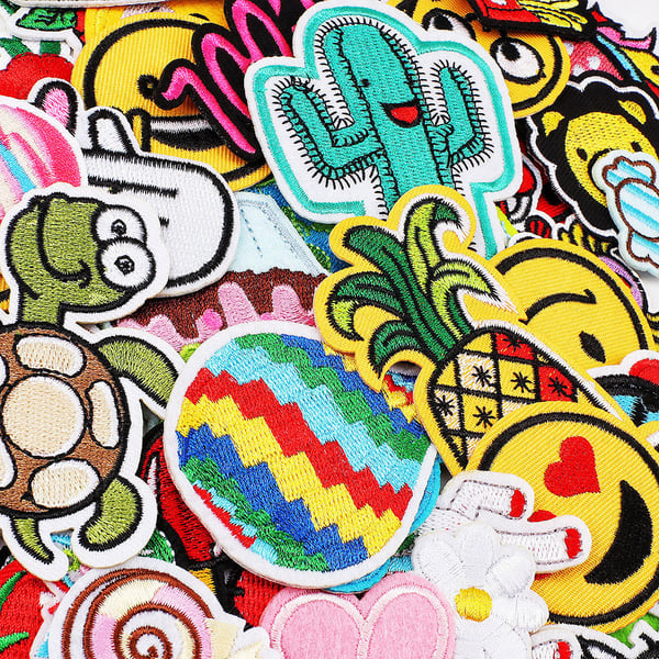 Broderede stofbadges i blandede motiver - 60 stk