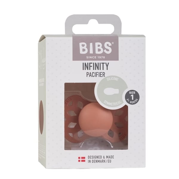 Infinity S peach 0+ symmetrinen silikonitutti, ruokalaput