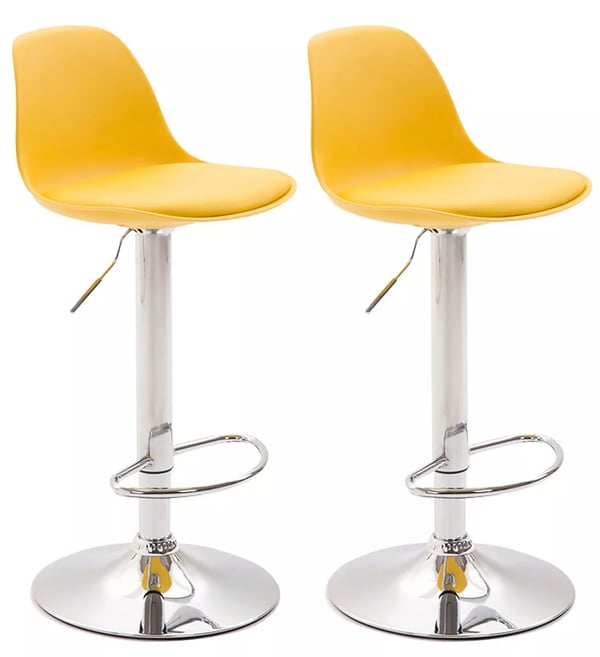 Set med 2 gula barstolar i konstläder med metallställ