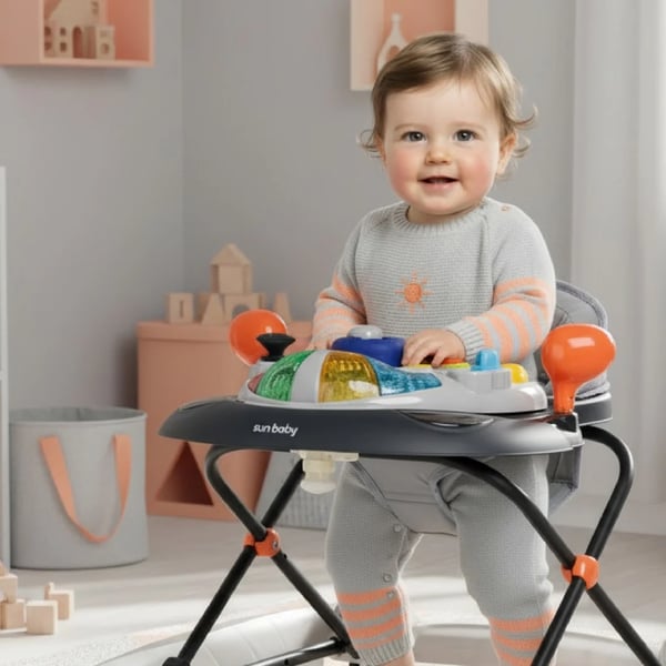 SUN BABY Gåstol för barn från 6 månader med mjuka 360° svängbara hjul och säkerhetsstopp, gungfunktion, upp till 12 kg grå