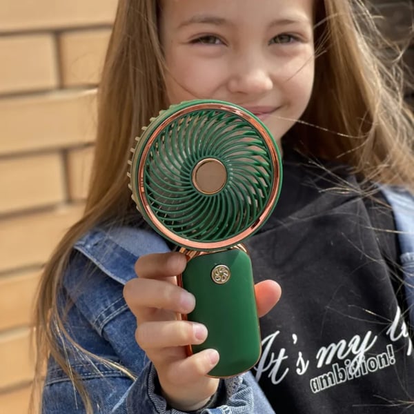 Mini lommeventilator i rosaguld med USB-genopladeligt batteri og stativ