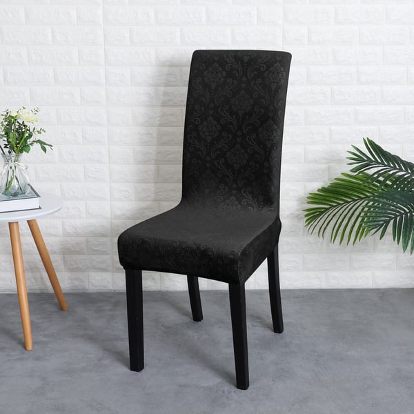 Paksu kohokuvioitu samettinen tuolinpäällinen, musta