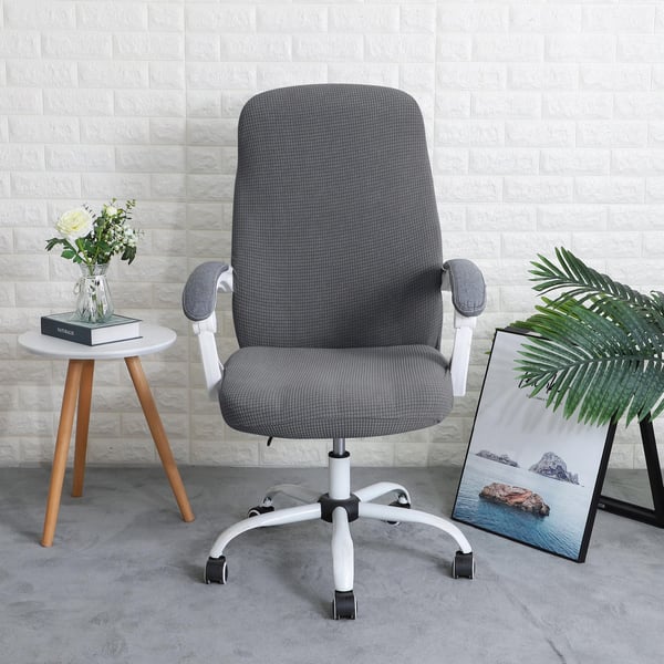 Harmaa jacquard-toimistotuolin päällinen pyörivällä tuolilla