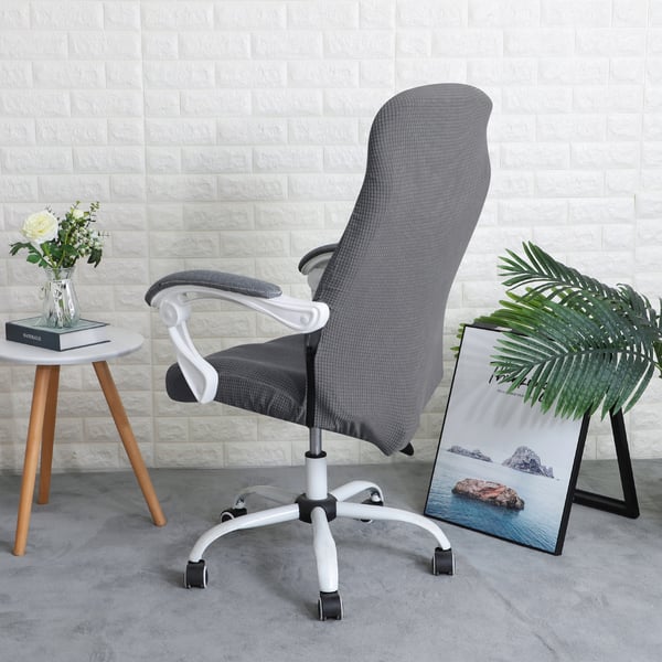 Harmaa jacquard-toimistotuolin päällinen pyörivällä tuolilla