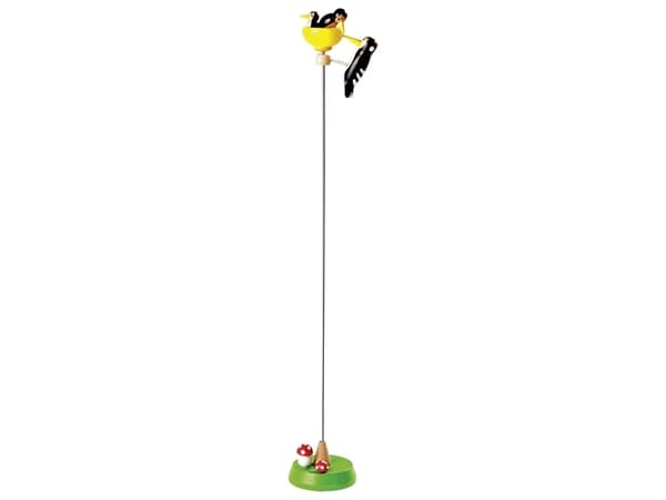 Tapping woodpecker on a stick