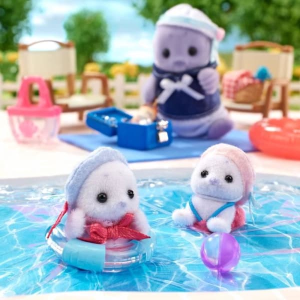Ledad familj - SYLVANIAN FAMILIES - Sälfamilj - 4 karaktärer och strandtillbehör