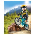 Miniatyrbild 4 av 4: Cyklist med mountainbike och trädstam