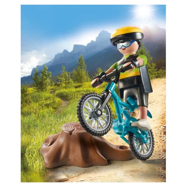 Cyklist med mountainbike och trädstam