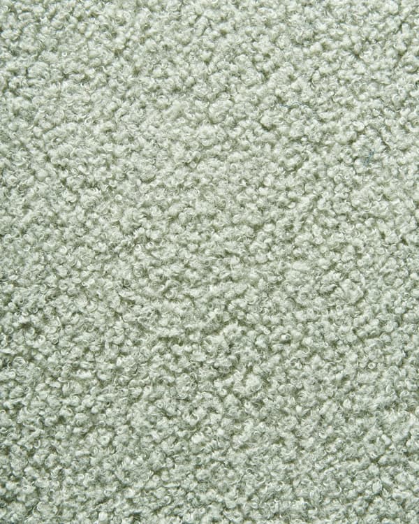 Lysegrøn boucle cocktail lænestol sort drejelig base glam retro lammeskind polstring