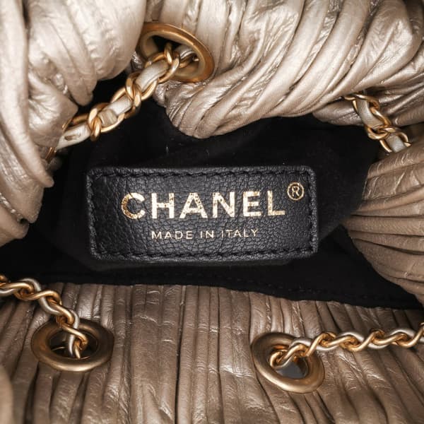 Pre-owned Chanel Medium Metallic Calfskin Coco Pleats Drawstring Backpack Gold