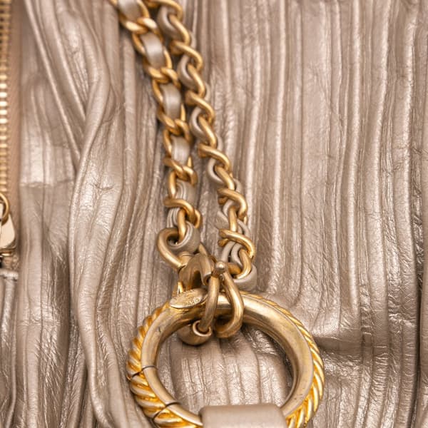 Pre-owned Chanel Medium Metallic Calfskin Coco Pleats Drawstring Backpack Gold