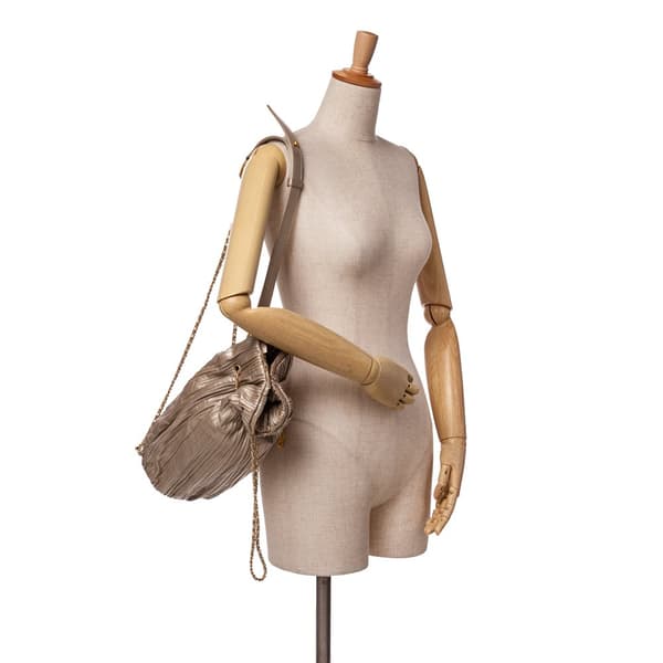 Pre-owned Chanel Medium Metallic Calfskin Coco Pleats Drawstring Backpack Gold