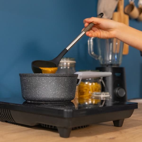 Cecotec Set of 9 utensils, with black head, covered by soft touch and steel handle in wood tone. The main materials consist of silicone, nylon and PP