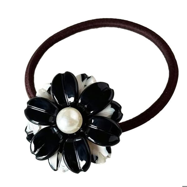 Elastisk vardagshårband med delikat kristallblomma i svart och vitt.