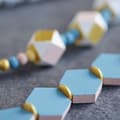 Miniatyrbild 2 av 4: Perle trä Lucy hexagon 20x4,7mm 15 stycken