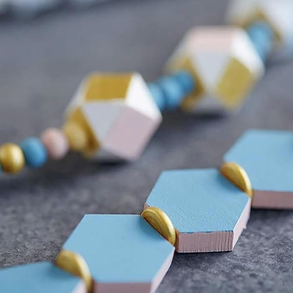 Perle trä Lucy hexagon 20x4,7mm 15 stycken
