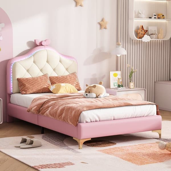 Klädd barnsäng med färgade LED-lampor och rosett på huvudgaveln - tillverkad av konstläder - 90 x 200 cm - med lamellram - rosa