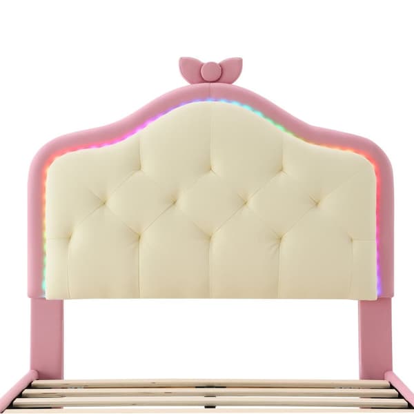 Klädd barnsäng med färgade LED-lampor och rosett på huvudgaveln - tillverkad av konstläder - 90 x 200 cm - med lamellram - rosa