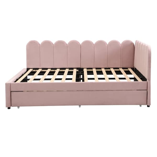 L-format polsterbäddsoffa 140x200 i rosa sammet med blommigt ryggstöd och utdragbar extrasäng