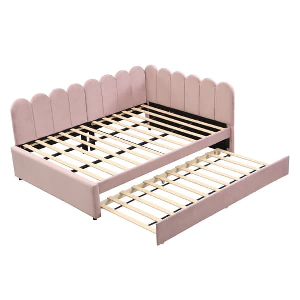 L-format polsterbäddsoffa 140x200 i rosa sammet med blommigt ryggstöd och utdragbar extrasäng