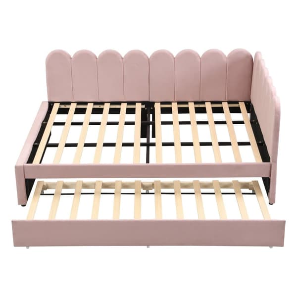 L-format polsterbäddsoffa 140x200 i rosa sammet med blommigt ryggstöd och utdragbar extrasäng