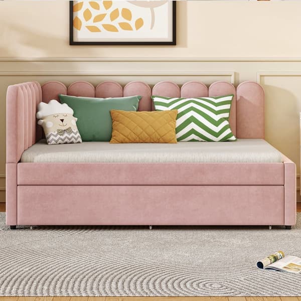 L-format polsterbäddsoffa 140x200 i rosa sammet med blommigt ryggstöd och utdragbar extrasäng
