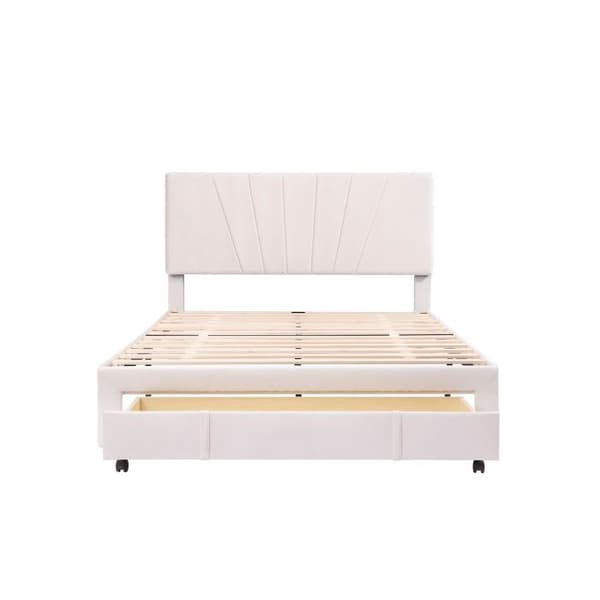 Dubbelbädd med stoppad sänggavel och stora lådor, beige (madrass ingår ej).