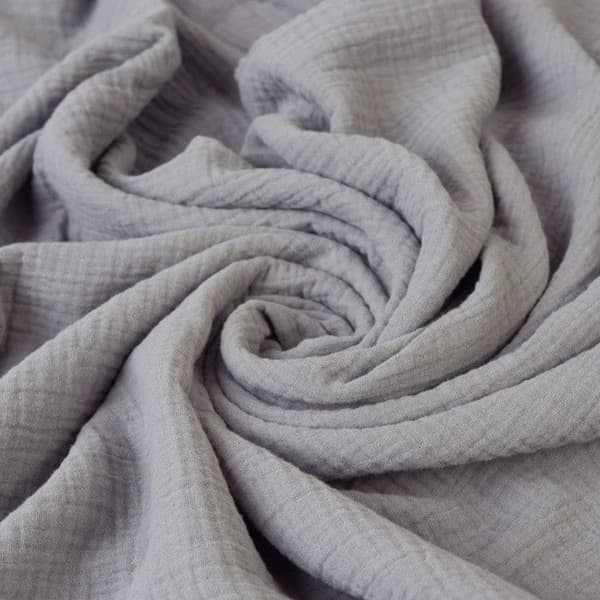 Underlakan i muslin i en låda 70x140x10